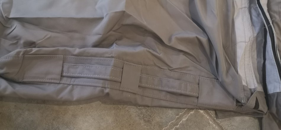 SEFM spa cover strap buckle stitching detail showing sewn webbing loops on gray fabric