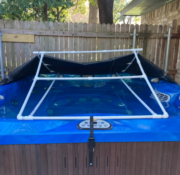 DIY PVC frame and tarp hot tub cover on an outdoor spa