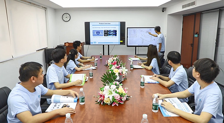 AlwayCare R&D team reviewing product overview and AI recognition technology