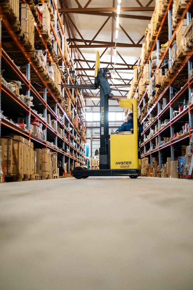 Forklift with laser positioning warning light in warehouse