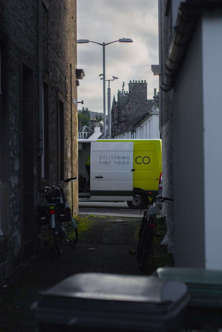 Delivery vehicle working in a dense urban street