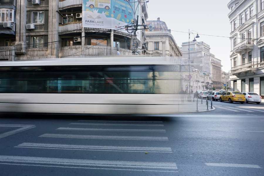 Passenger bus travelling through an urban road