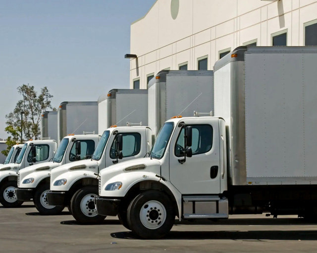 Commercial vehicles staged in a loading yard