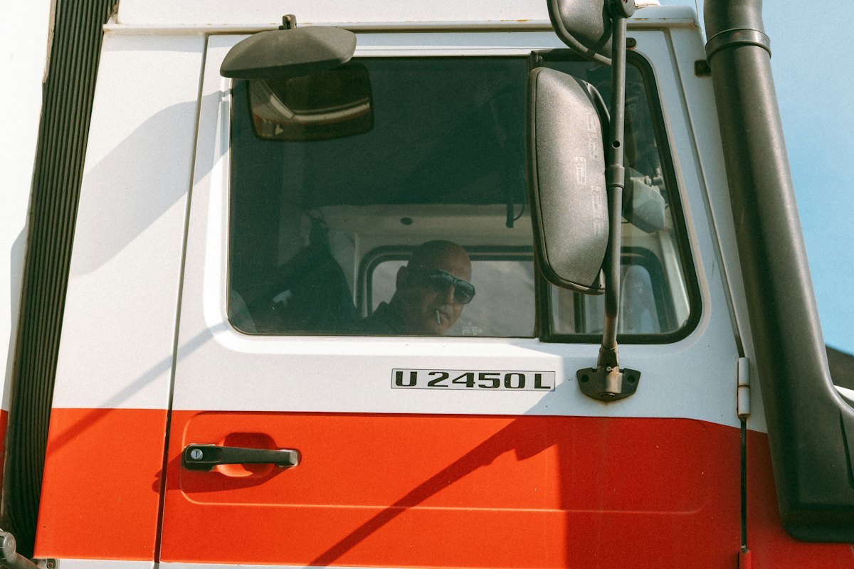 Professional truck driver in a commercial vehicle cab