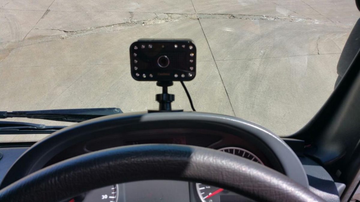 Dashboard installation of AlwayCare MR688-PV fatigue sensor in crew transport vehicle.