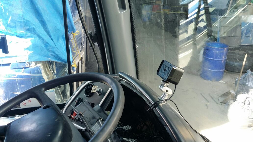 Dashboard-mounted AlwayCare MR688-PV integrated with fleet GPS tracking unit.