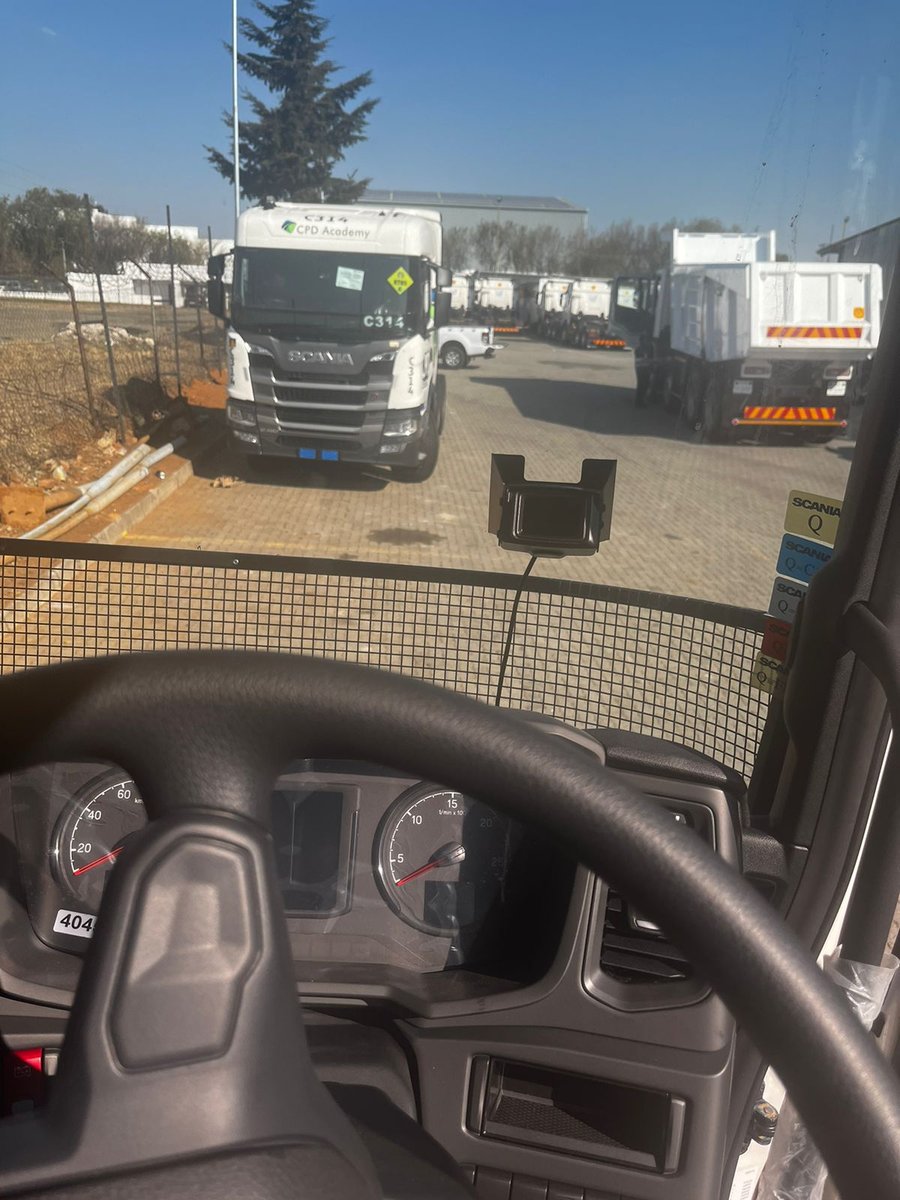 View from the driver seat showing the installed device on the windscreen