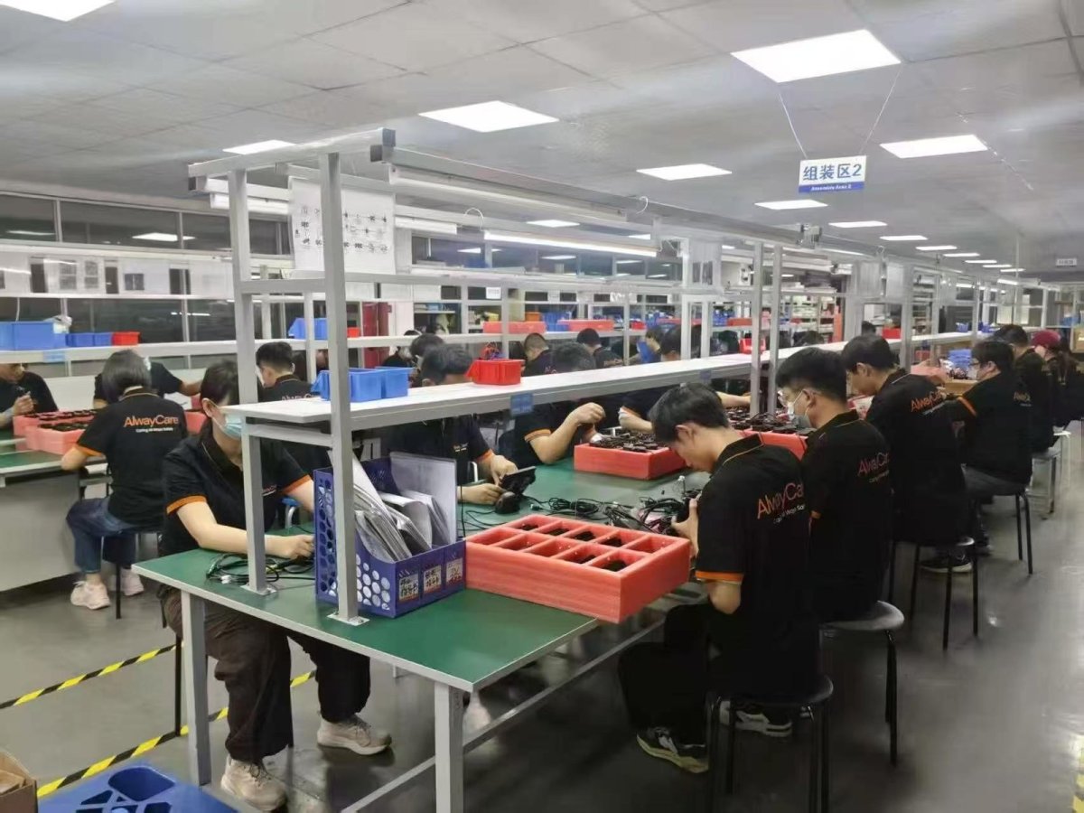 AlwayCare assembly line with technicians at work benches