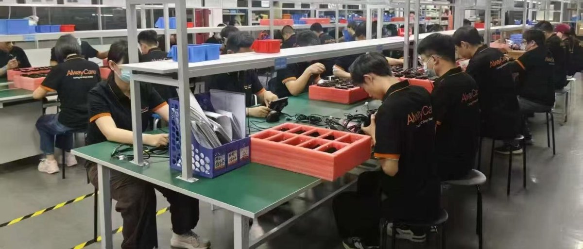 AlwayCare assembly line with technicians at work benches