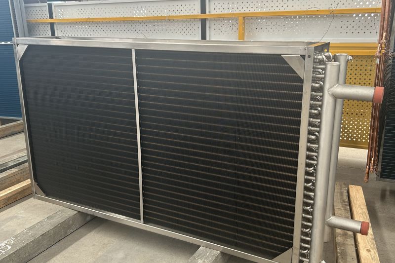 All stainless steel tube and fin surface cooler for corrosive environments