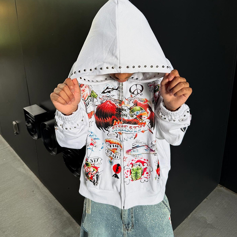 Oversized white hoodie with colorful retro print and rhinestones, modeled outdoors, suitable for luxury custom streetwear brands