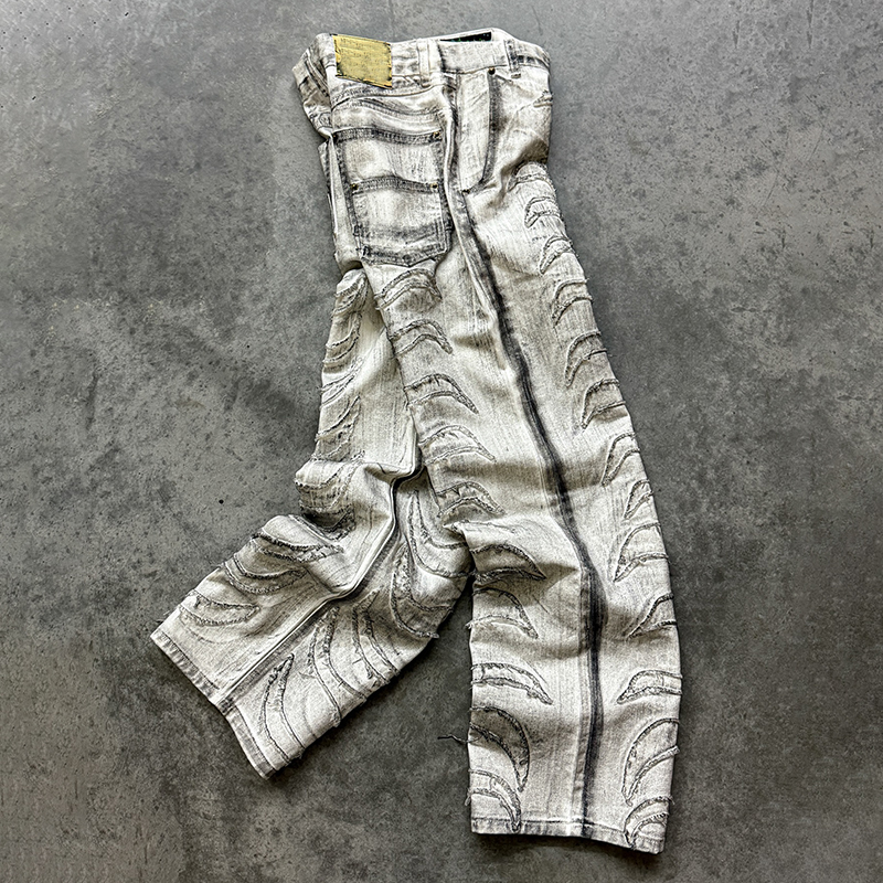 Close-up of men streetwear pants with raw edge patchwork, custom pants manufacturer Groovecolor