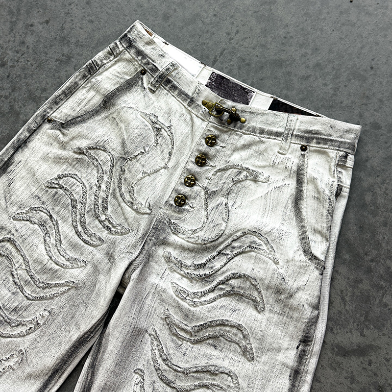 Close-up of men streetwear pants with raw edge patchwork, custom pants manufacturer Groovecolor
