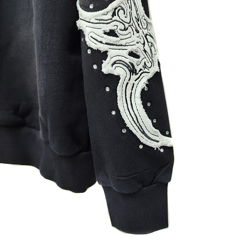 Detailed look at layered DTG patch construction on custom hoodie by China embroidered hoodie factory Groovecolor