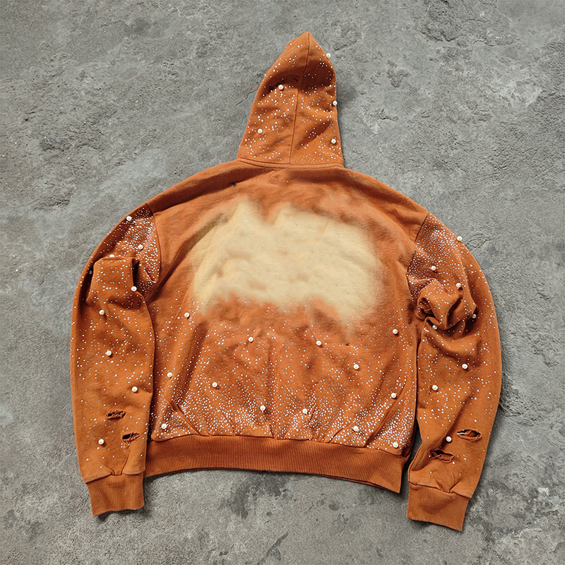 Back view of rust acid wash hoodie with all-over pearls and fading, y2k streetwear production for global brands