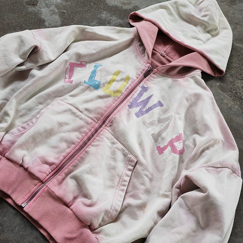 Pink rib cuffs and cropped waistband on Groovecolor acid wash zip hoodie, premium construction for US streetwear clothing buyers.