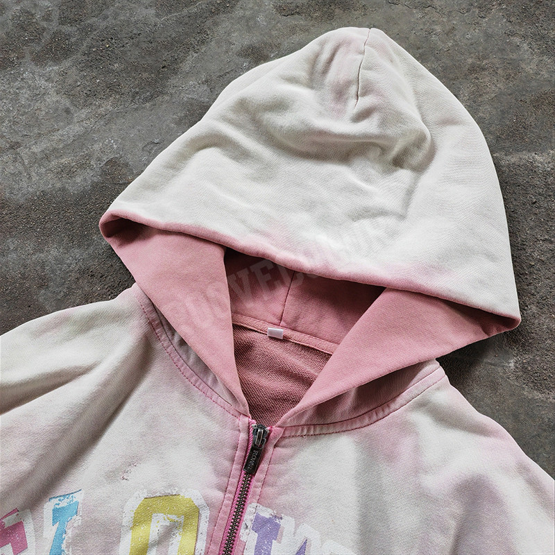 Distressed multicolor FLOWAR typography on Groovecolor Y2K hoodie, custom painted hoodies execution for European streetwear brands.