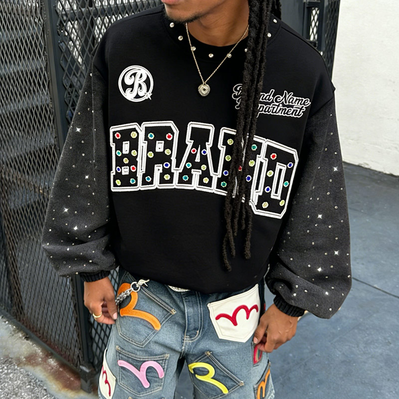 An expert technician at Groovecolor's China facility meticulously inspects the seams of a heavyweight French terry sweatshirt, showcasing the rigorous quality control in streetwear manufacturing for US brands.