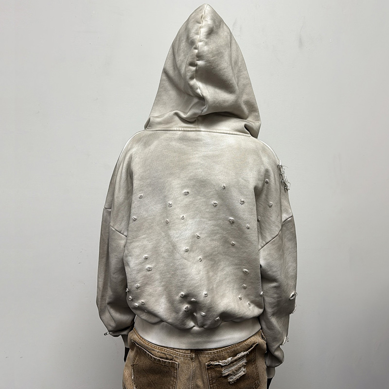 A detailed shot of a premium heavyweight hoodie from a Sydney-based streetwear brand, showcasing the fabric texture and quality construction.