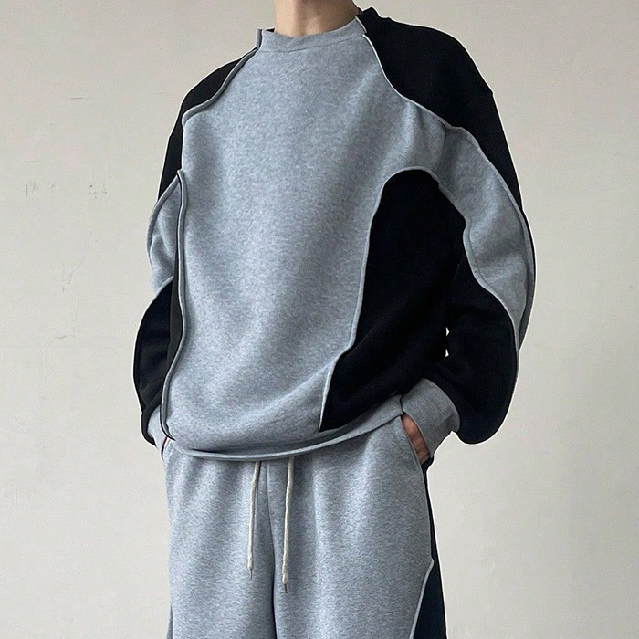 Quality control in streetwear manufacturing line for oversized hoodies