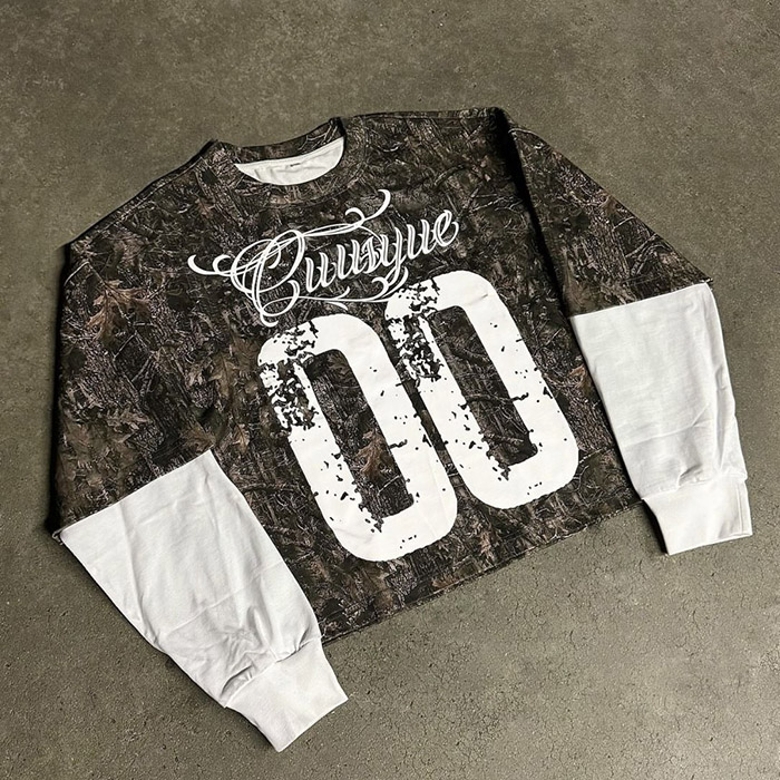 California T-shirt manufacturing team reviewing premium oversized tee construction in Los Angeles