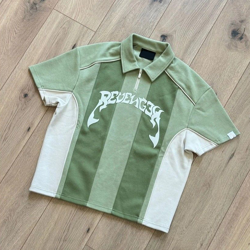 Retro sports polo sample review in Dongguan, China, showing striped collar and terry texture for streetwear development