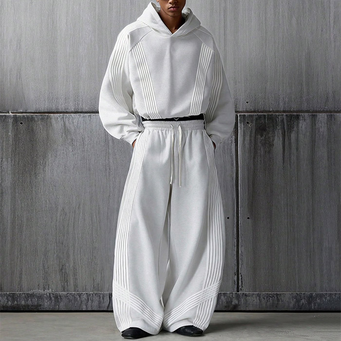 OEM luxury streetwear manufacturer reviewing premium custom clothing production details
