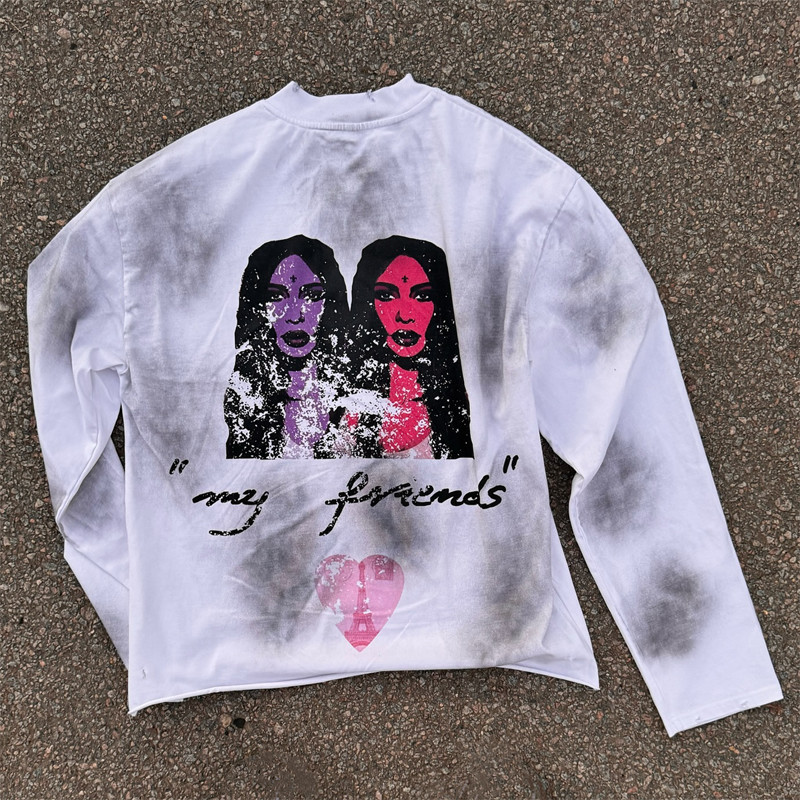 Oversized white long sleeve tee showcasing monkey wash and black spray paint effects by Groovecolor.
