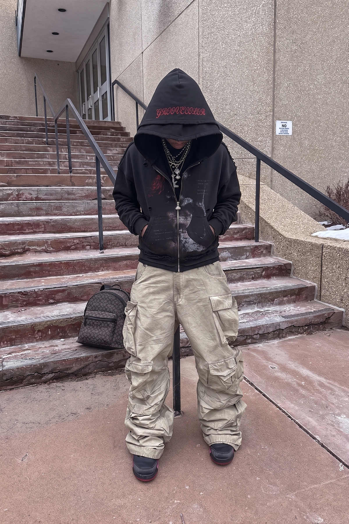 Black heavyweight cotton fleece hoodie featuring vintage graphic application by Groovecolor.