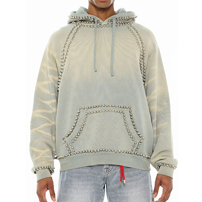 Quality control in streetwear manufacturing inspecting enzyme washed fleece finish for custom vintage hoodies