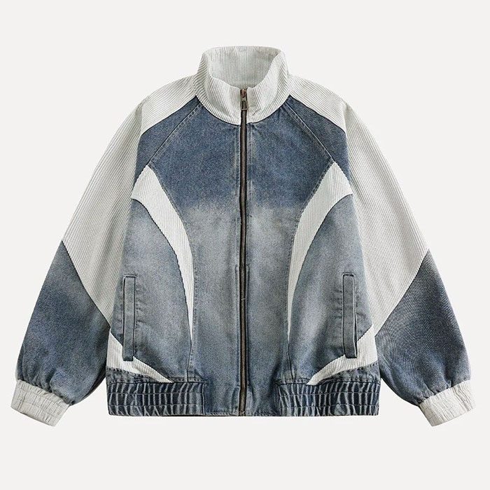 Quality control in custom streetwear manufacturing, checking embroidered baseball jacket panel alignment
