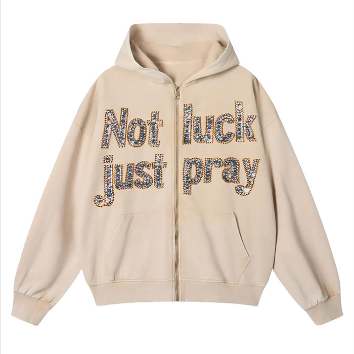 Dongguan OEM production line checking embroidery placement on men’s streetwear zip-up hoodies
