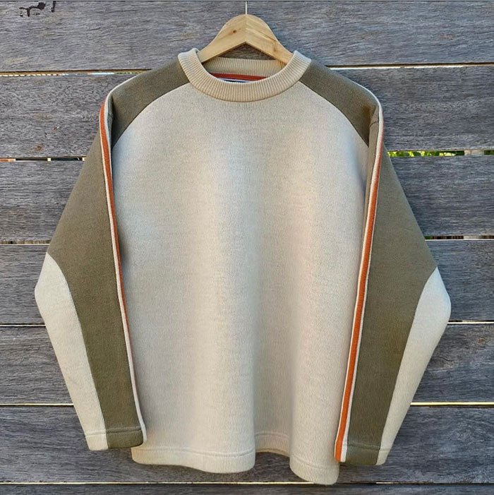 Dongguan sweatshirt manufacturing team reviewing premium streetwear collection samples and fabric specifications