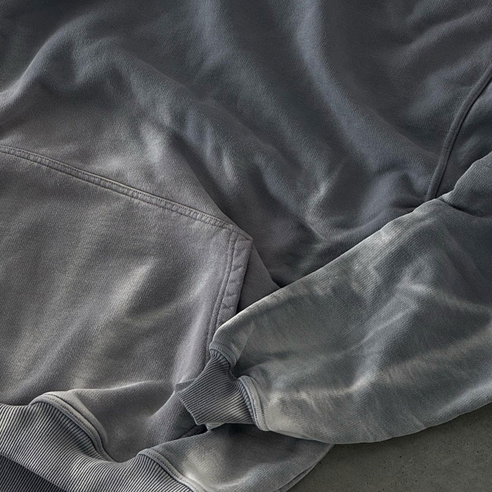 Vintage wash streetwear sample compared with controlled bulk wash production standards