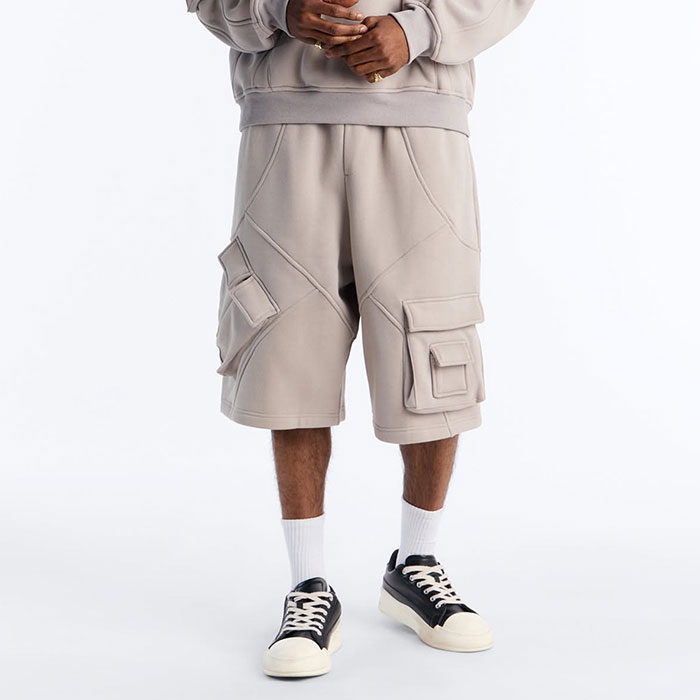 Acid wash cargo shorts sample review in a Dongguan streetwear production room