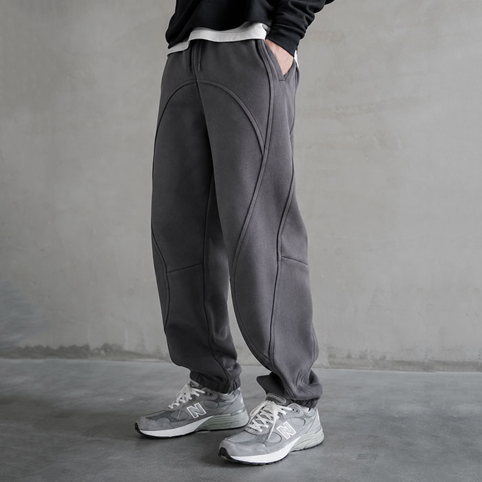 China-based OEM jogging suit manufacturer reviewing hoodie and jogger set samples for mens streetwear brands