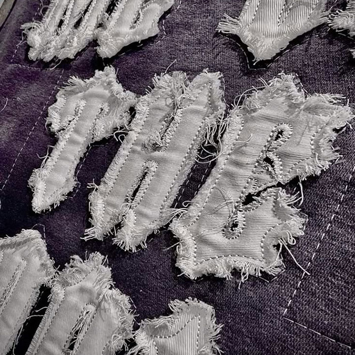 from artwork digitizing and stitch files to fleece selection, backing, placement, oversized grading, garment washing, sampling, and bulk approval