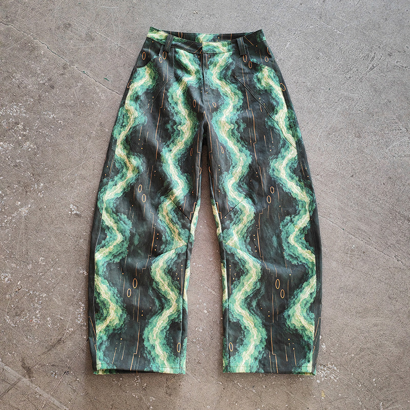 Side profile shot men’s abstract print baggy denim hip hop trousers streetwear fit