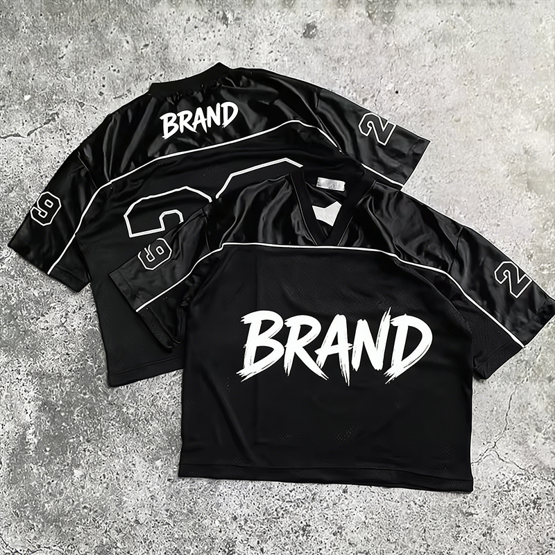 Streetwear football jersey styles off-field fits 2026 — oversized mesh V-neck and retro collar jerseys styled with baggy denim