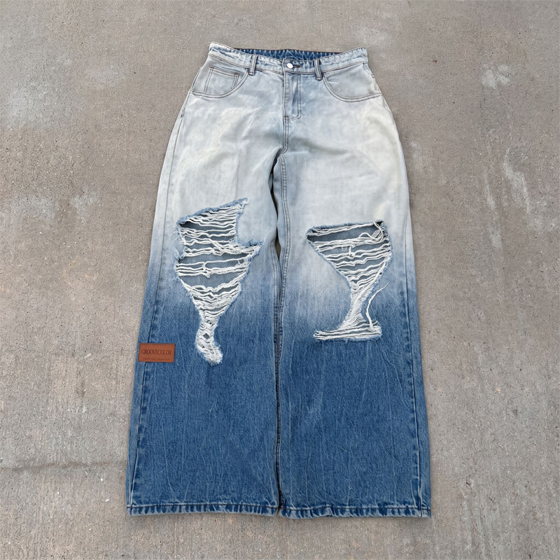 Light to dark blue gradient wash denim jeans featuring custom cut and sew manufacturing by Groovecolor.