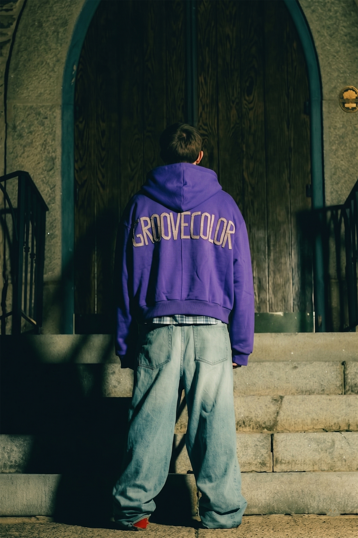 Close up of mixed media layered plaid and satin lining inside custom zip hoodie by Groovecolor.