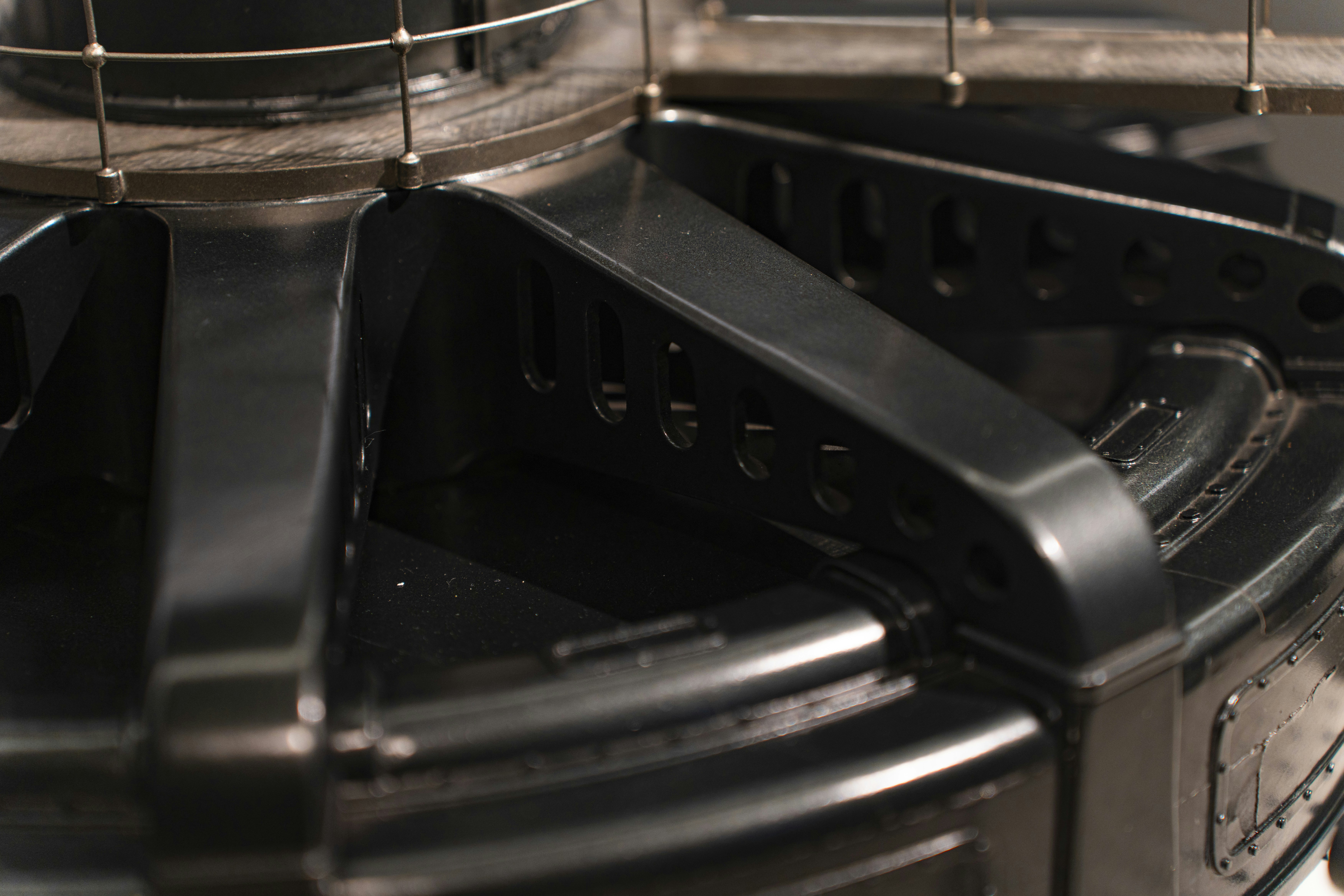 A stainless steel three-compartment sink in a commercial kitchen.