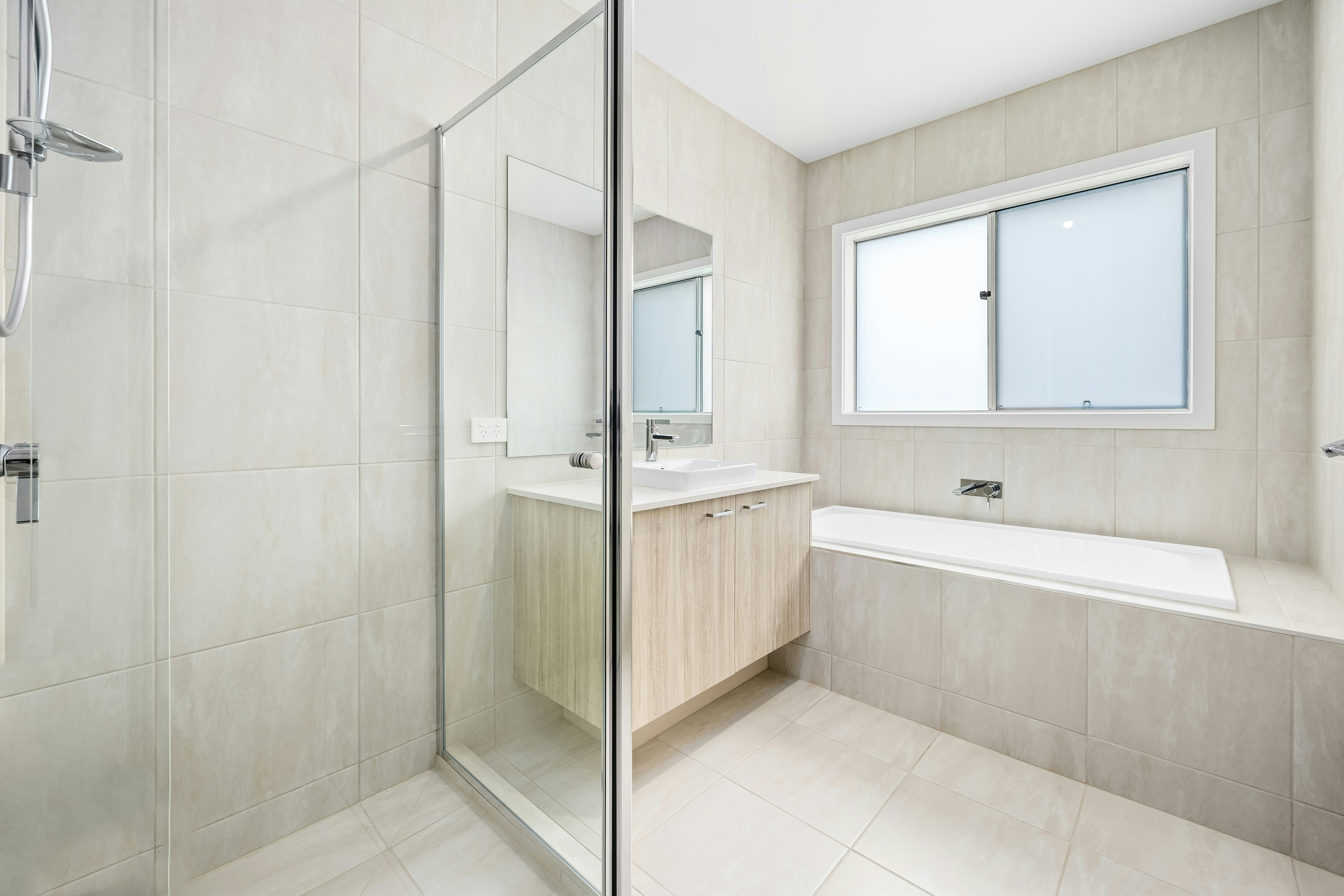 Before and after of a commercial restroom renovation, showing the new ADA-compliant layout.
