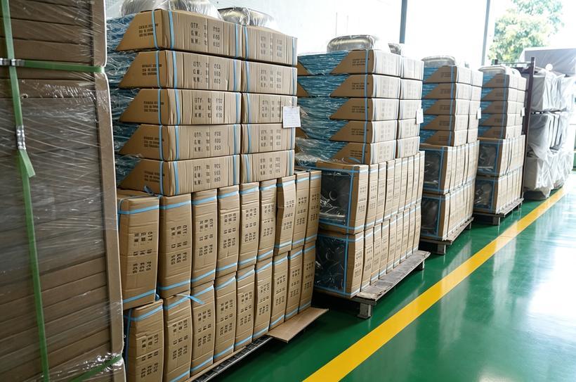 Palletised stainless steel single sinks with drainboard in the Samsink warehouse