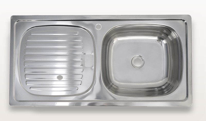 Front view of the one-piece drawn stainless steel sink body with bowl and integrated drainboard