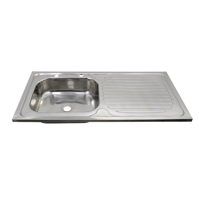 faucet hole on the drainboard of a reversible top mount kitchen sink