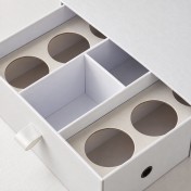 Precision paperboard and molded fiber packaging insert
