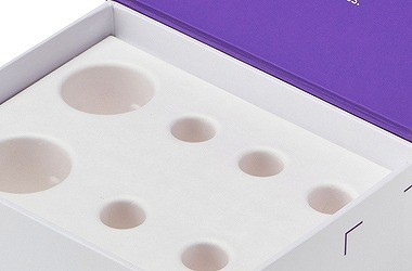 Molded fiber insert for sustainable spirits packaging