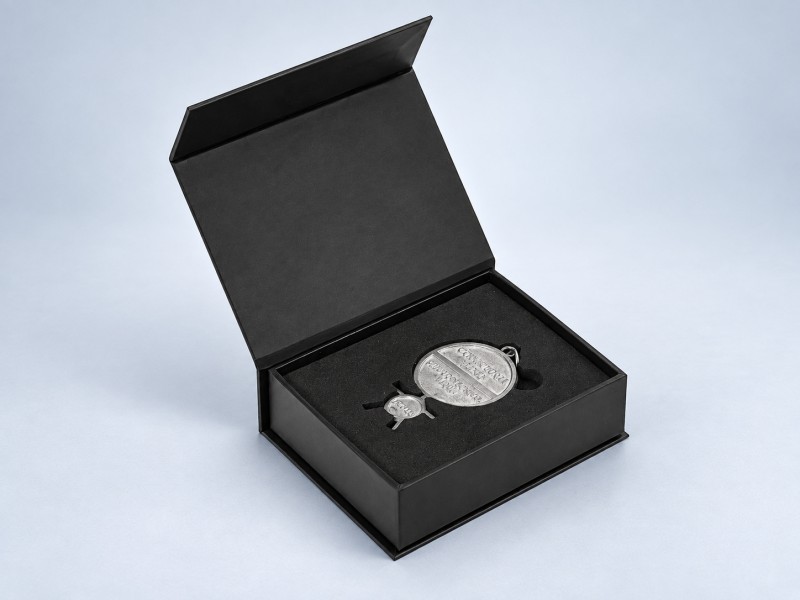 Open magnetic closure box presenting product inside custom insert