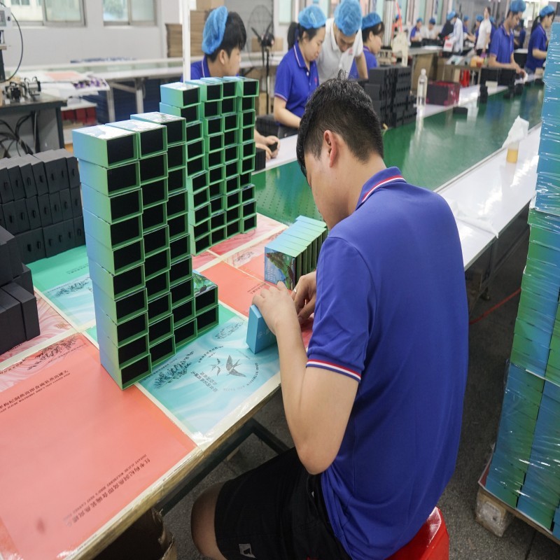 Quality inspection of custom rigid packaging boxes at DHP Boxes manufacturing factory